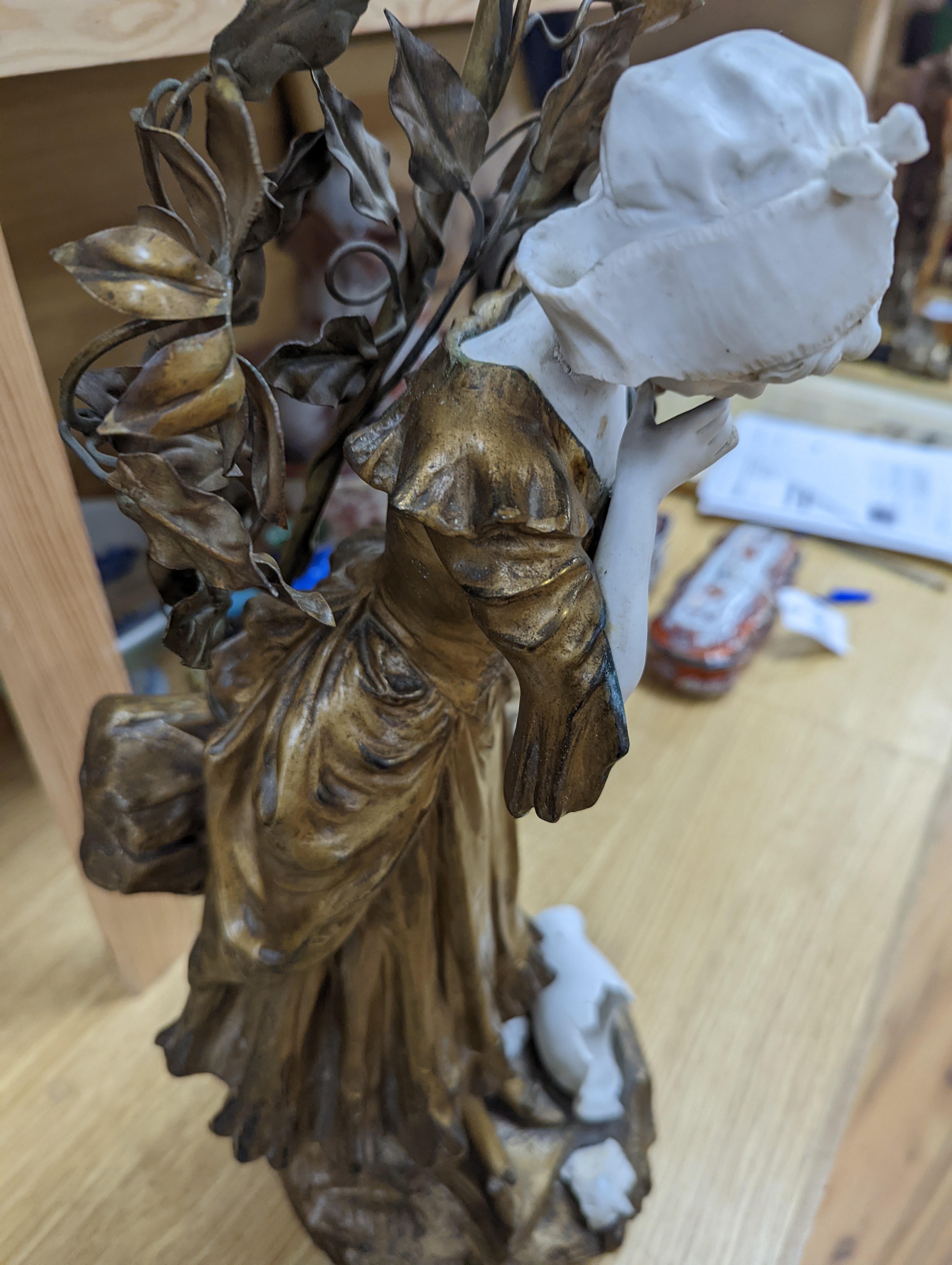 A late 19th Century French gilt spelter and bisque porcelain figure after Mednat 54cm